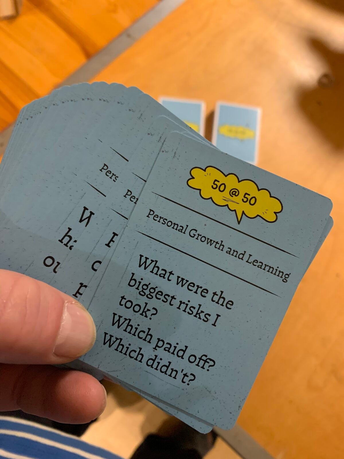 Holding a 50 @ 50 reflection card
